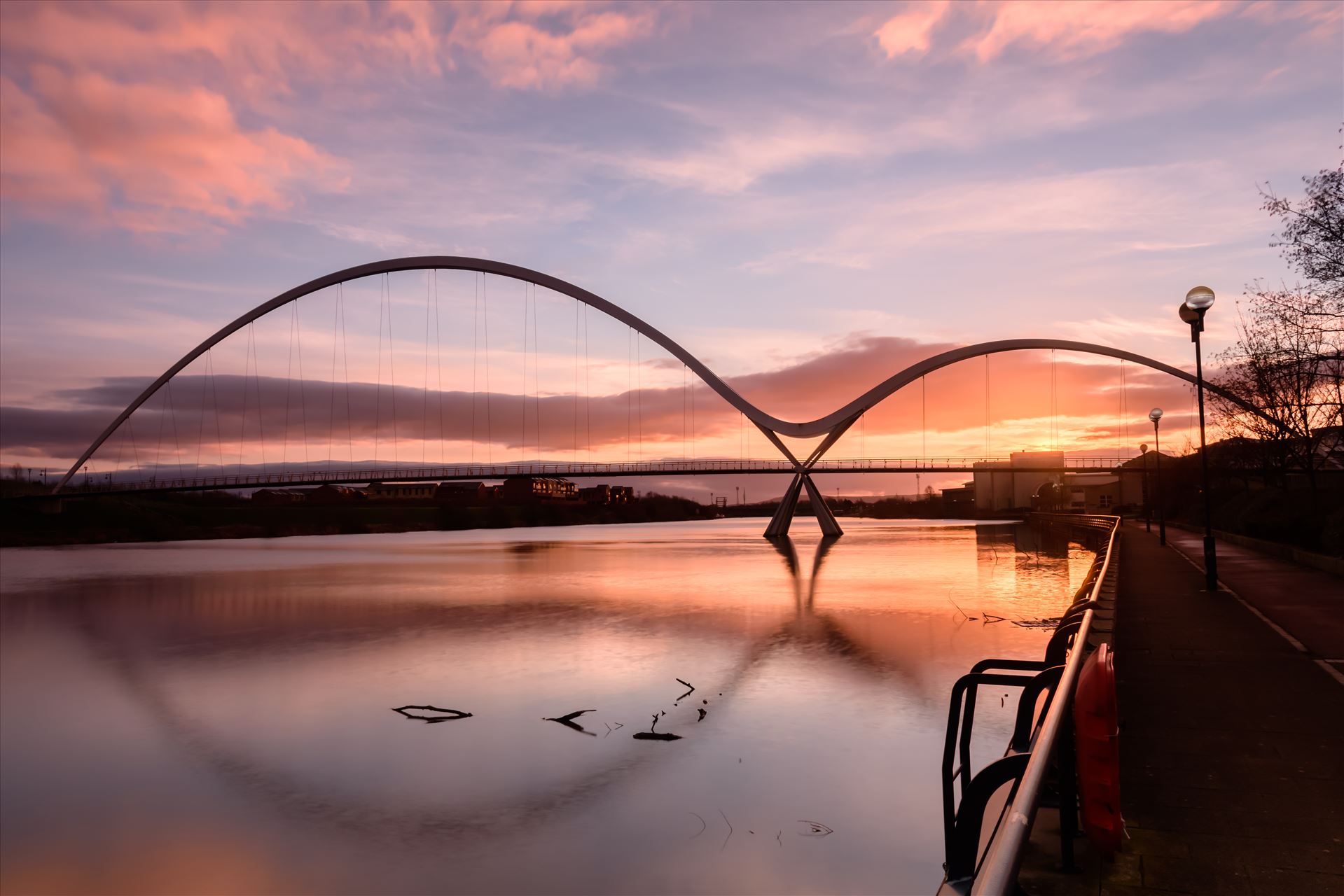 The Infinity Bridge 12 - The Infinity Bridge is a public pedestrian and cycle footbridge across the River Tees that was officially opened on 14 May 2009 at a cost of £15 million. by philreay