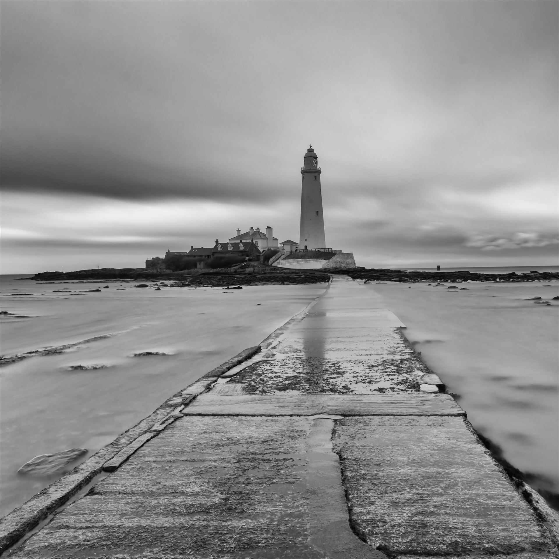 St Mary`s lighthouse - St Mary`s lighthouse stands on a small rocky tidal island is linked to the mainland by a short concrete causeway which is submerged at high tide. The lighthouse was built in 1898 & was decommissioned in 1984, 2 years after becoming automatic. by philreay
