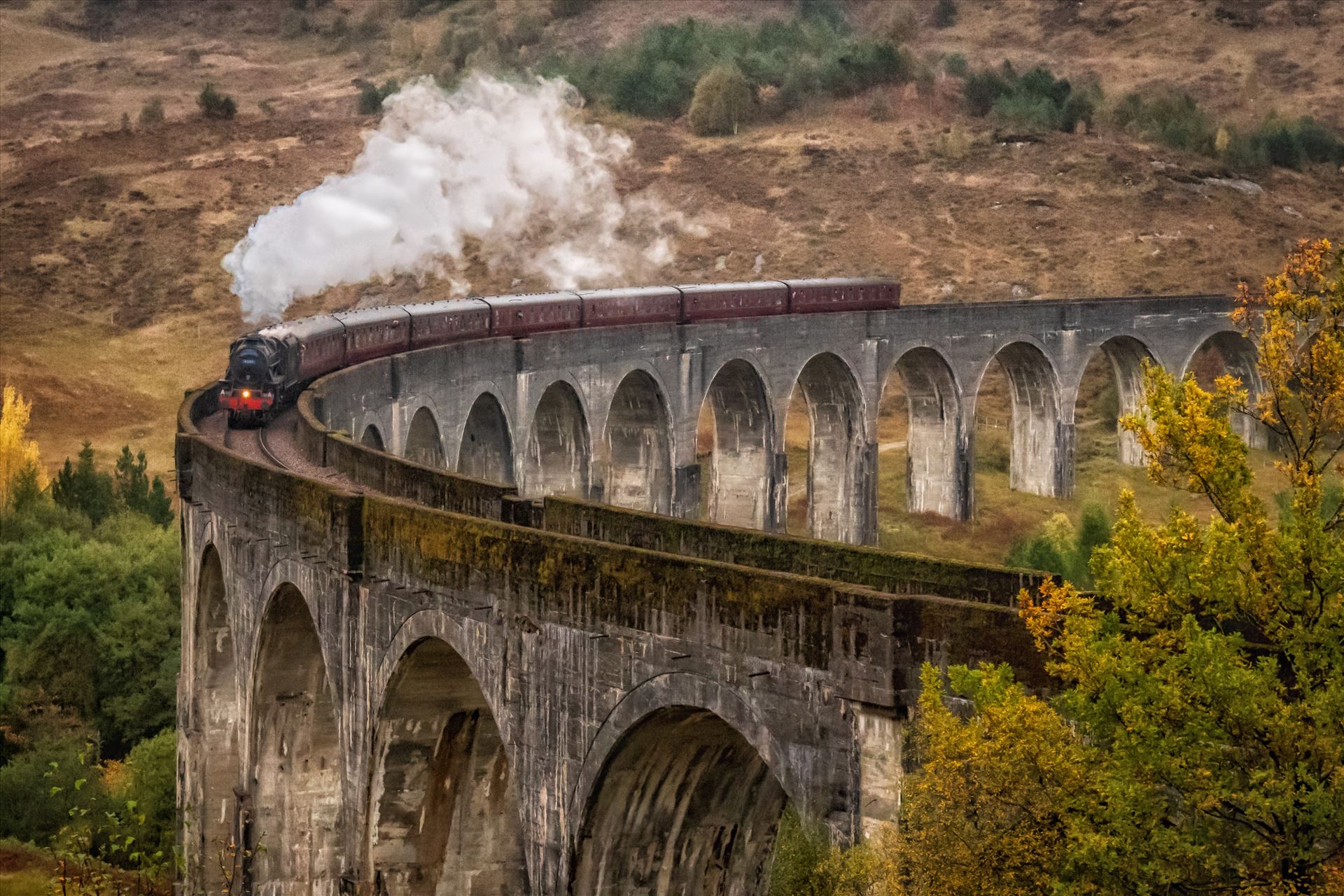 The Glenfinnan Viaduct (2) - The Glenfinnan viaduct is a railway viaduct on the West Highland line which connects Fort William and Malaig. The viaduct has been the location for many films and tv series but probably most famous for the Harry Potter films. by philreay