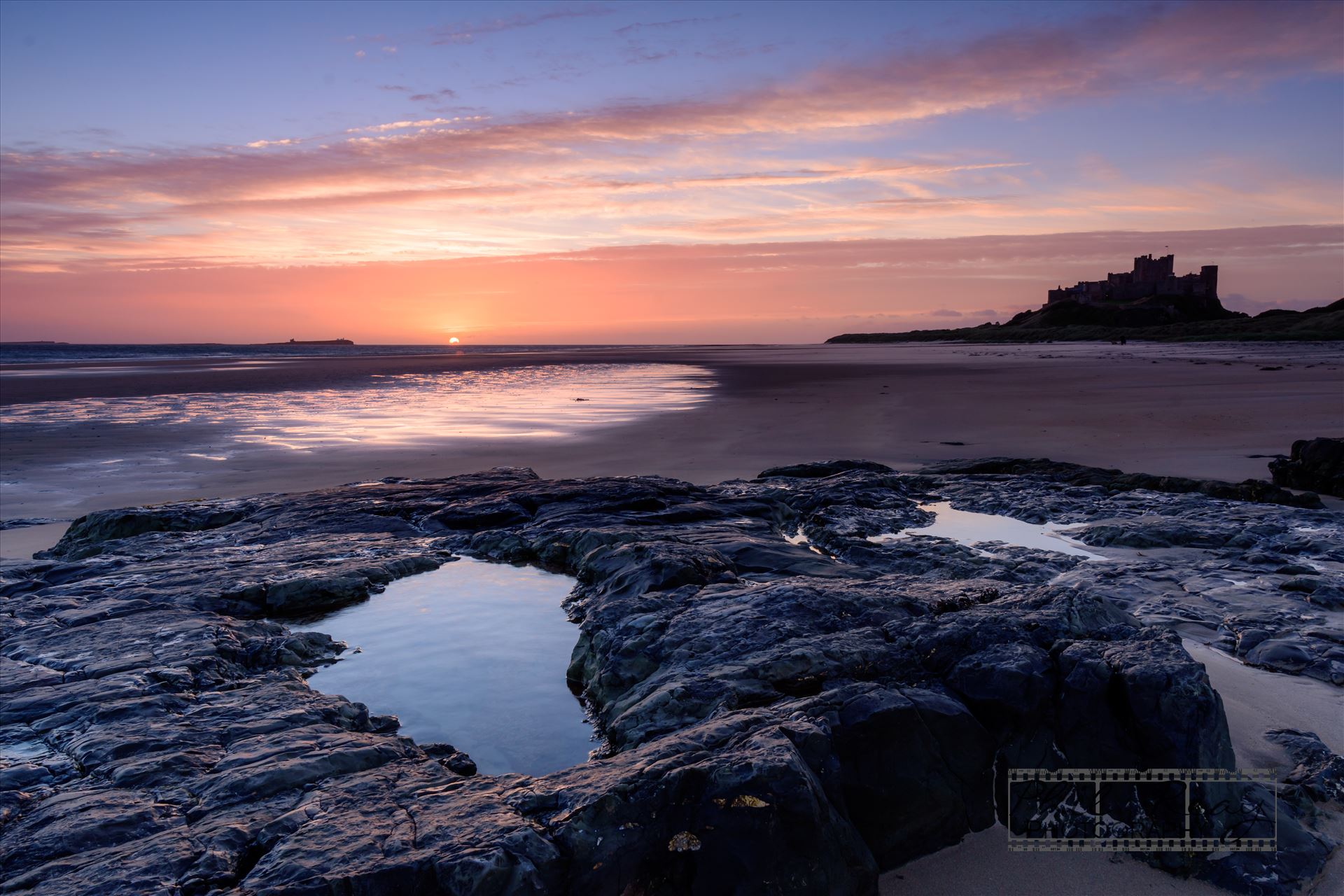 Bamburgh Castle & beach -  by philreay