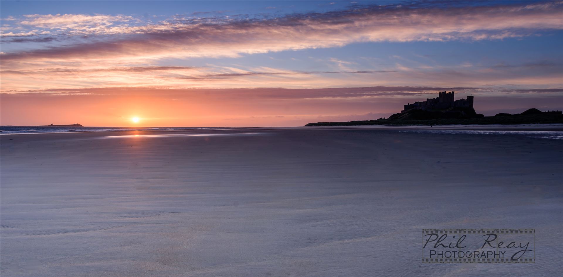 Bamburgh Castle & beach -  by philreay