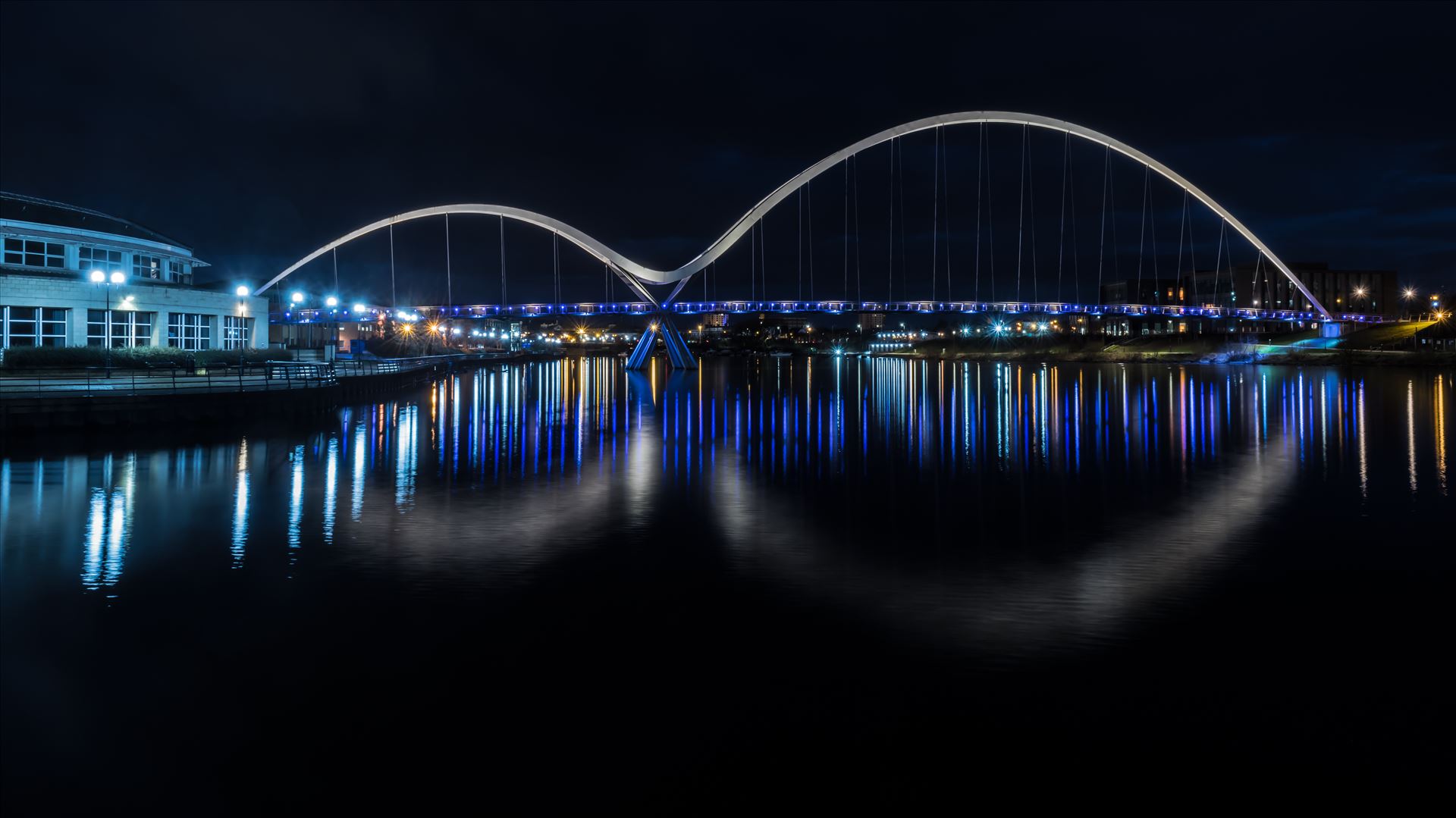 The Infinity Bridge 08 - The Infinity Bridge is a public pedestrian and cycle footbridge across the River Tees that was officially opened on 14 May 2009 at a cost of £15 million. by philreay