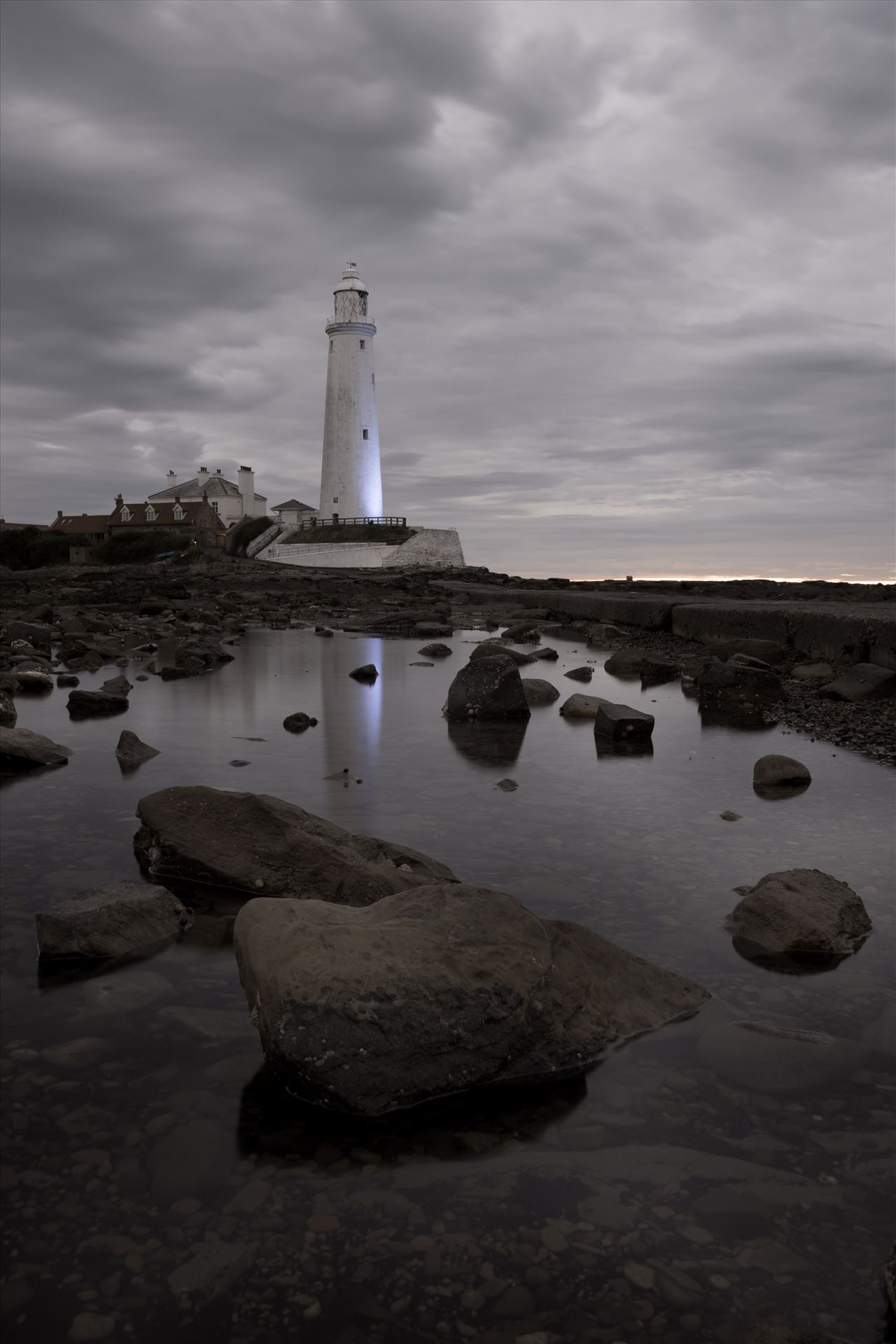 St Mary`s Island & lighthouse - St Mary`s lighthouse stands on a small rocky tidal island is linked to the mainland by a short concrete causeway which is submerged at high tide. The lighthouse was built in 1898 & was decommissioned in 1984, 2 years after becoming automatic. by philreay