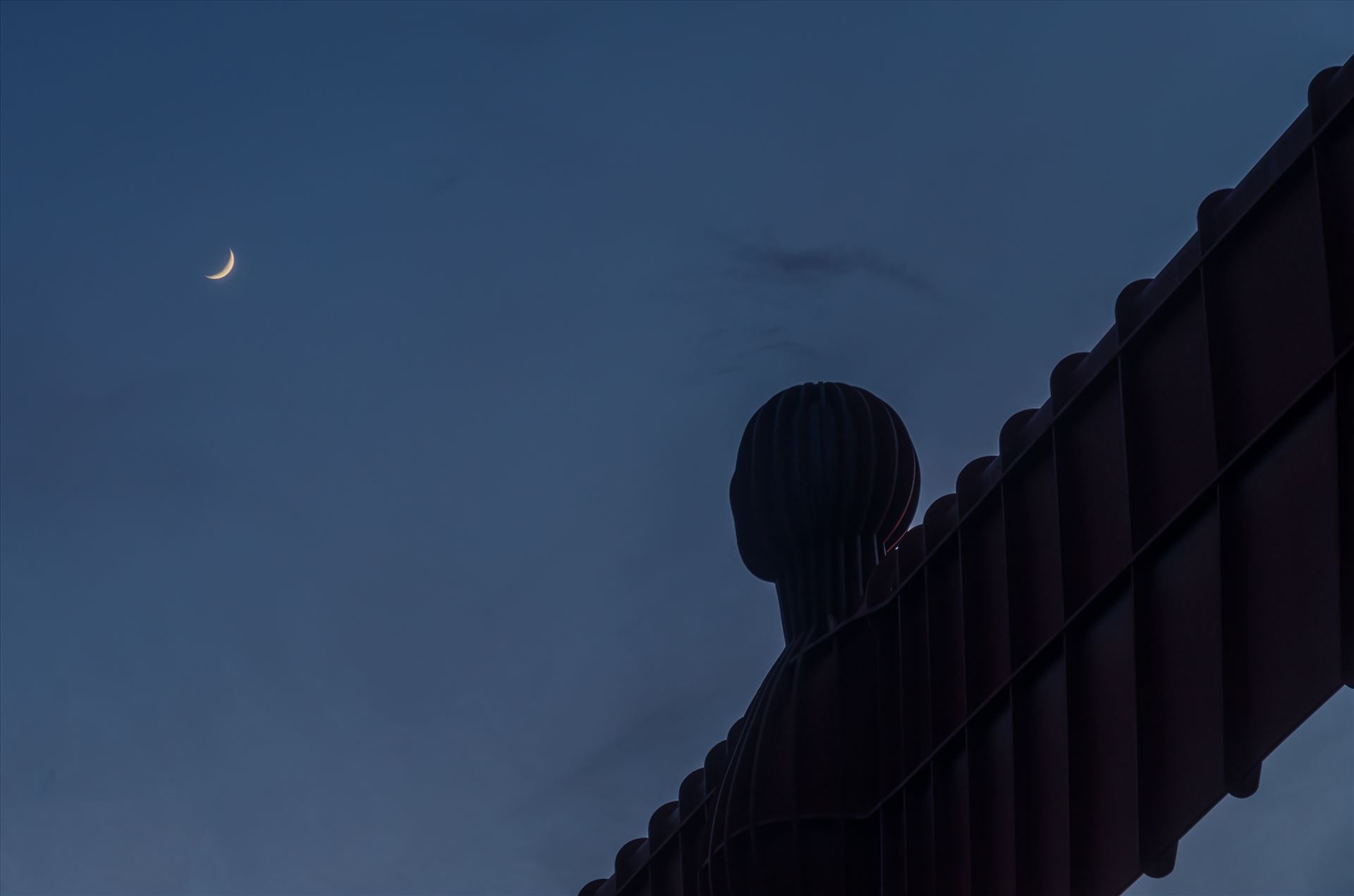 The Angel of the North - The Angel of the North is a contemporary sculpture, designed by Antony Gormley, located in Gateshead,  England.Completed in 1998, it is a steel sculpture of an angel, 20 metres (66 ft) tall, with wings measuring 54 metres (177 ft) across. by philreay