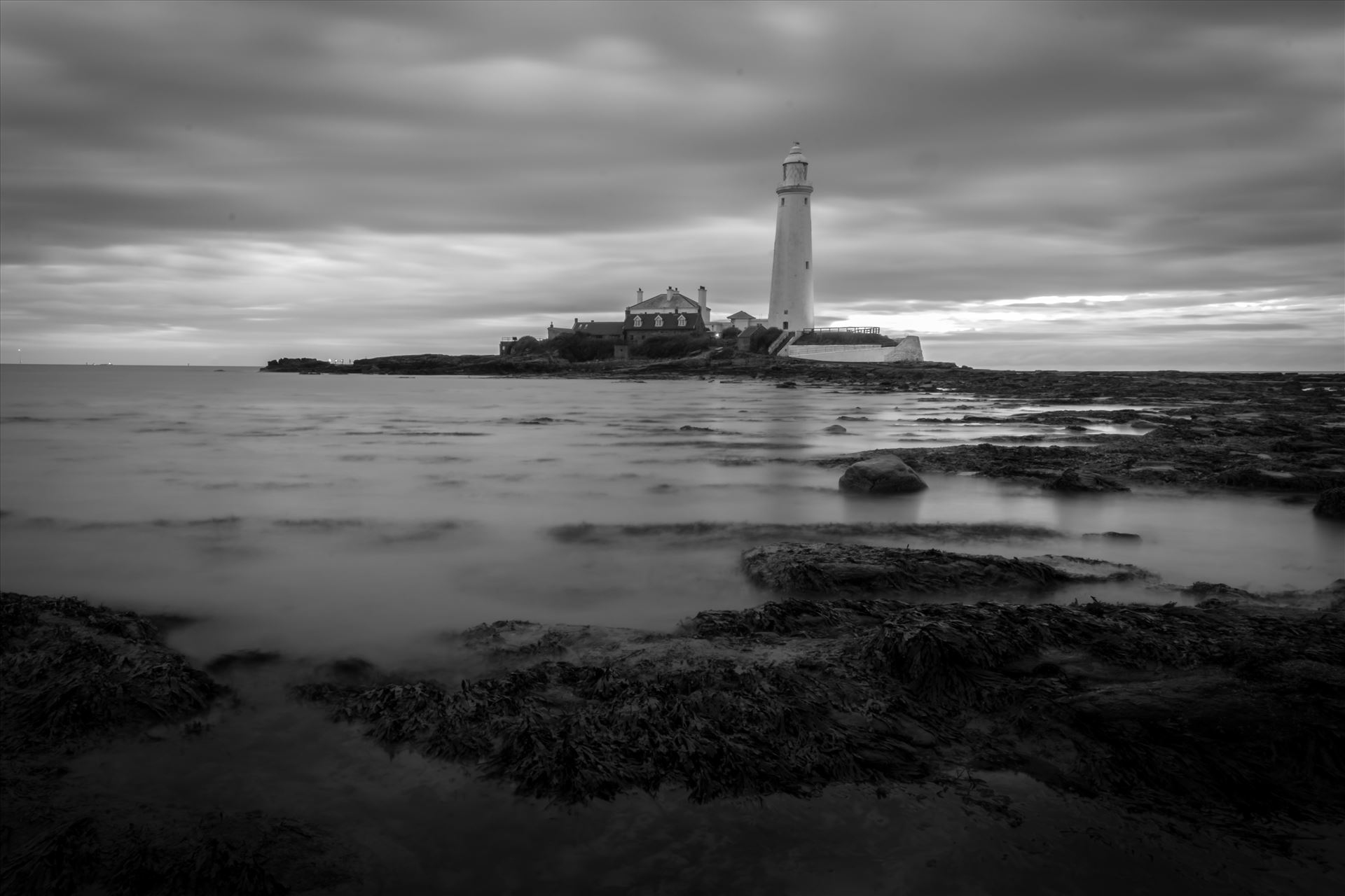 St Mary`s lighthouse, Whitley Bay - St Mary`s lighthouse stands on a small rocky tidal island is linked to the mainland by a short concrete causeway which is submerged at high tide. The lighthouse was built in 1898 & was decommissioned in 1984, 2 years after becoming automatic. by philreay