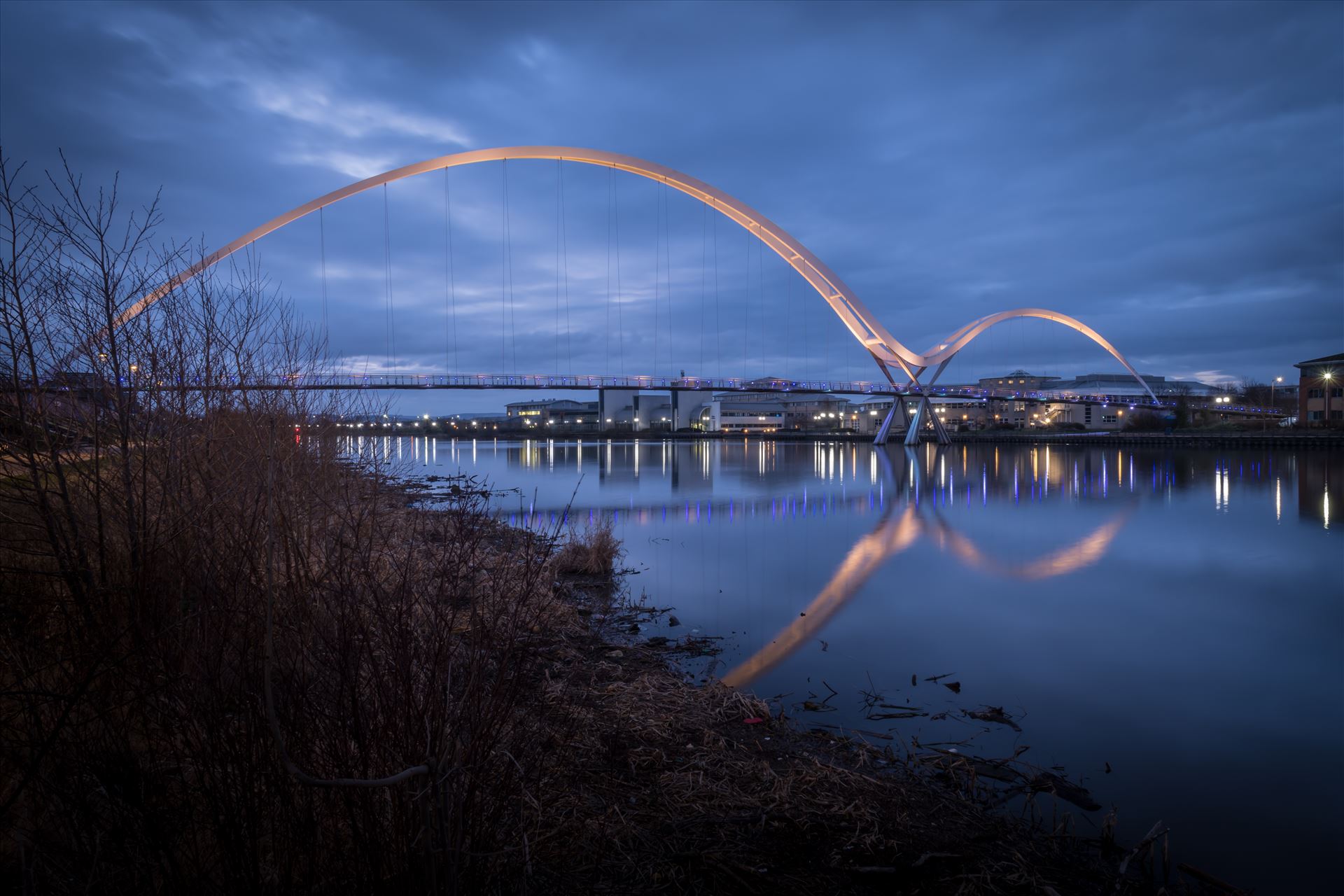 The Infinity Bridge 04 - The Infinity Bridge is a public pedestrian and cycle footbridge across the River Tees that was officially opened on 14 May 2009 at a cost of £15 million. by philreay