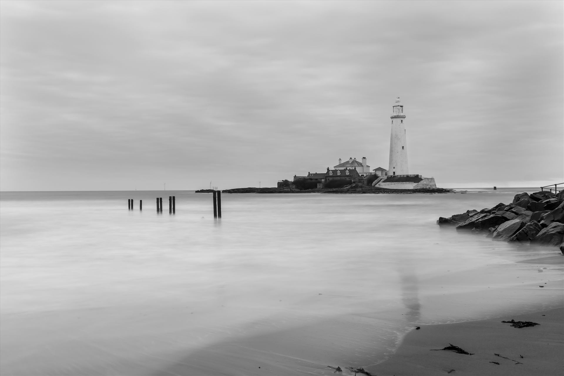 St Mary`s lighthouse, Whitley Bay (B&W) - St Mary`s lighthouse stands on a small rocky tidal island is linked to the mainland by a short concrete causeway which is submerged at high tide. The lighthouse was built in 1898 & was decommissioned in 1984, 2 years after becoming automatic. by philreay