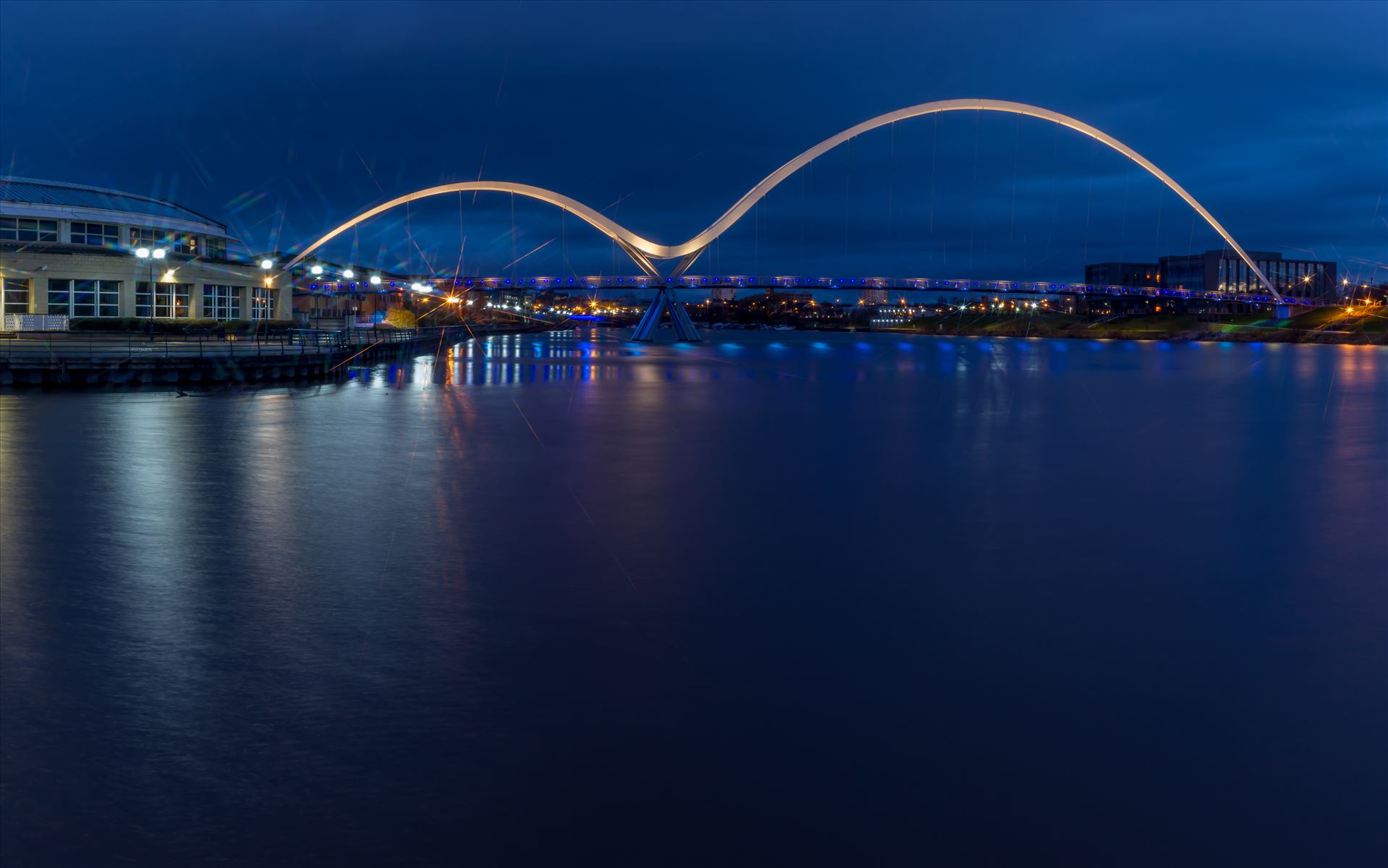 The Infinity Bridge 15 - The Infinity Bridge is a public pedestrian and cycle footbridge across the River Tees that was officially opened on 14 May 2009 at a cost of £15 million. by philreay