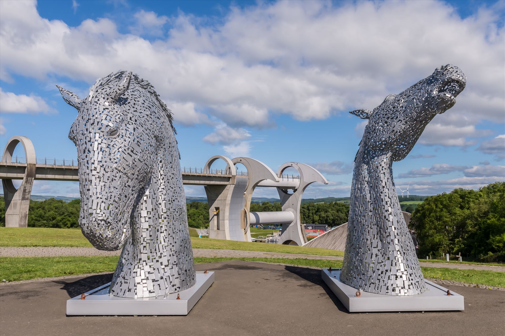 The Falkirk Wheel & miniature Kelpies - The Falkirk Wheel is a rotating boat lift in Scotland, connecting the Forth and Clyde Canal with the Union Canal. It opened in 2002, reconnecting the two canals for the first time since the 1930s as part of the Millennium Link project. by philreay