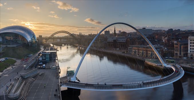 Gateshead & Newcastle quaysides at sunset - Taken from the viewing platform on level 4 of the Baltic arts building. This photo is made from 3 separate images stitched together to make this panoramic shot.